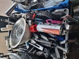 a pile of assorted kitchen utensils on the back of a truck
