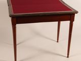 an image of a small table with a red cloth on it