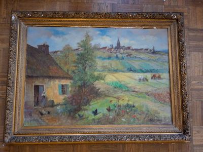 a painting on the wall of a room with wood paneling