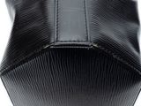 a close up of a black purse on a white background