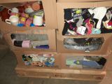 a cardboard box filled with assorted items in a room
