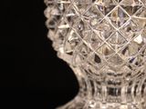 a glass vase that is sitting on a table