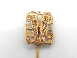 an image of a gold broochle on a white background