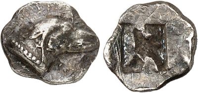 a close up of a coin with a bear on it