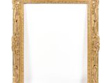 an antique gold frame with a white background