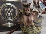 figurines of a woman with a sword and a statue of a man on a boat