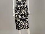 a black and white dress with a floral print on it