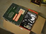 a box with a game controller inside of it on the floor