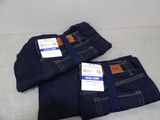 two pairs of men ' s jeans sitting on top of each other