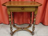 an old wooden table with a mirror on top of it