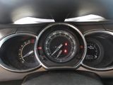 a close up of a car dashboard with gauges and speedometers
