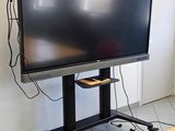 a flat screen tv sitting on a stand in the corner of a room
