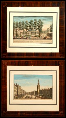 two framed pictures of a view of a city with a clock tower