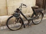 a bike that is parked on the side of the street