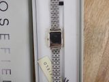 a watch that is sitting in a box on a table