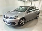the silver car is parked in the garage of the building