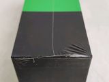 a green and black box on a white surface