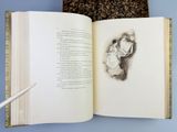 an open book with a drawing of a man and a woman on it