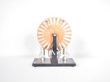 a clock that is sitting on a stand on a white surface