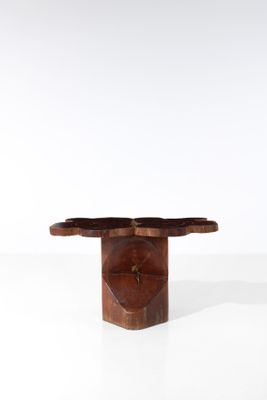a close up of a small wooden table on a white surface