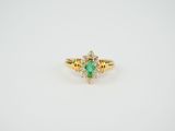 an oval emerald and diamond ring