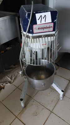 an image of a kitchen with a mixer on the floor