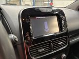 a picture of a car dashboard with a cell phone in it