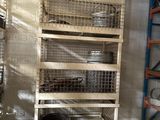 a shelf with baskets on top of it in a room