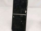 a cell phone that is sitting on top of a stand