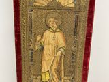 an image of a gold and red case with a picture of a man