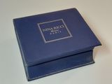 an image of a blue box with the name nina picci paris on it