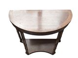 a small wooden table with a curved top on a white background