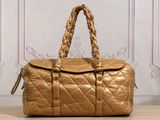 chanel gold quilted leather duffel bag with braid handles