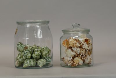 two glass jars with different types of food in them