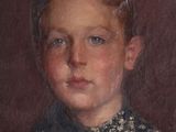 portrait of a young boy in a blue shirt and black tie
