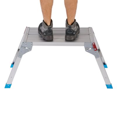 the legs of a man standing on top of a step stool