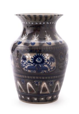 a blue and white vase sitting on a white surface