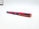 the pen is red and black with a gold trim