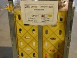 a box with a sign on top of it in a warehouse