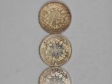 three different types of coins sitting on top of each other