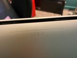 a laptop that is sitting on a desk in a room