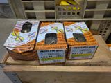 three boxes of cat food sitting on top of a wooden table
