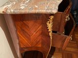 a table with a marble top in a room