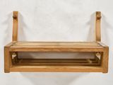 a wooden shelf with a shelf attached to it