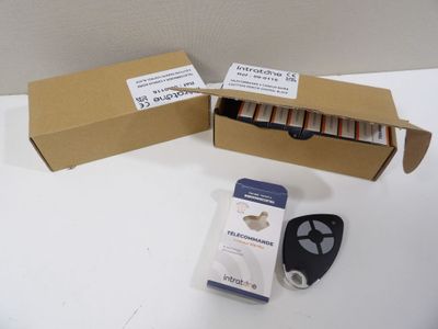 a box of batteries and a remote control on a table