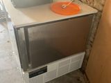 a microwave sitting on top of a counter next to a wall