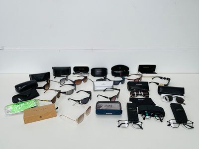 a lot of electronic gadgets and other items on the table