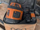 an orange and black cordless drill in a case on a table
