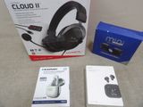 a box of headphones sitting on a table next to a pair of earphones