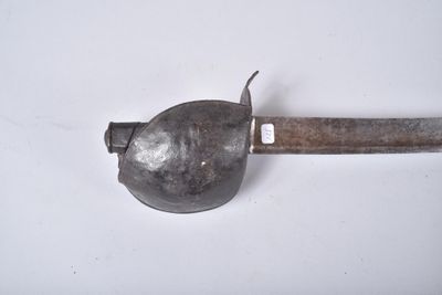 a small metal object with a metal handle on a white surface